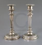 A pair of George IV silver candlesticks, Matthew Boulton, Birmingham 1825, with gadrooned borders