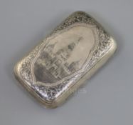 A late 19th century Russia 84 zolotnik silver and niello cigarette case, decorated with a view of