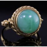 An early-mid 20th century 18ct gold and cabochon jadeite set dress ring with ropetwist border and