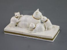 A Rockingham porcelain group of a cat and three kittens, c.1830, decorated in gilt and white, the