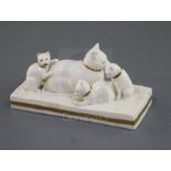 A Rockingham porcelain group of a cat and three kittens, c.1830, decorated in gilt and white, the