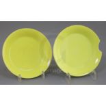 A fine pair of Chinese lemon yellow saucer dishes, Yongzheng mark and possibly of the period, each