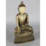 A large Burmese sculpted marble seated figure of Buddha, 18th/19th century with remnants of