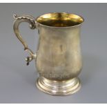 A George III silver baluster mug by Hester Bateman, with acanthus leaf capped handle and later