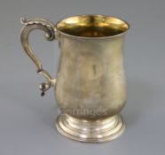 A George III silver baluster mug by Hester Bateman, with acanthus leaf capped handle and later