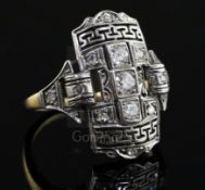 An Art Deco style platinum, yellow gold and diamond set tablet ring, with Greek Key pierced