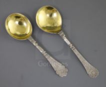 Two 18th century Scandinavian silver spoons, with gilded bowls and both terminals engraved with