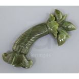 A Mughal spinach jade dagger handle, carved with spiral fluted grip and foliate base, 5.75in.