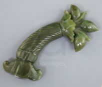 A Mughal spinach jade dagger handle, carved with spiral fluted grip and foliate base, 5.75in.