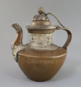 A Tibetan copper and silver teapot, 19th century, the silver boards embossed with the eight Buddhist
