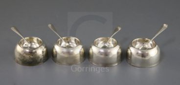 A set of four early George I Britannia standard silver circular salts by James Goodwin, with