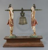 A Burmese bronze bell and polychrome wood stand, late 19th/early 20th century, in the form of two
