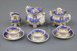 A Rockingham porcelain miniature tea set, c.1830-42, each piece painted with flower sprays within