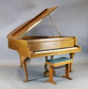 A Bluthner walnut cased boudoir grand piano, with shell carved cabriole legs and pad feet, W.4ft