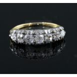 An early 20th century gold and graduated old cut diamond seven stone diamond half hoop ring, size