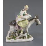 A Meissen group of the Tailor's wife, c.1750, the wife seated on a goat with suckling kid and