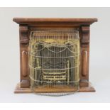 A late Victorian mahogany miniature fireplace, with brass and cast iron insert, 11.5in. height 10.
