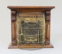 A late Victorian mahogany miniature fireplace, with brass and cast iron insert, 11.5in. height 10.