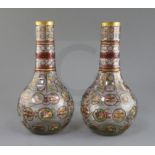 A pair of Bohemian Ottoman Market glass bottle vases, late 19th century, each enamelled and ruby