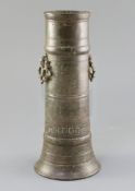 A 17th century Indian bronze vase, with pierced ring handles and ring turned decoration, lacks base,