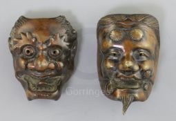 Two Japanese bronze models of noh masks, 19th century, cast as Shoki and an oni, H. 5.5 and 4.7cm