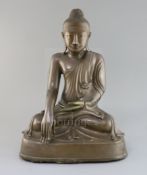 A large Burmese Mandalay bronze seated figure of Buddha Shakyamuni, 19th century, with enamel