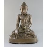 A large Burmese Mandalay bronze seated figure of Buddha Shakyamuni, 19th century, with enamel