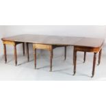 A Regency mahogany dining table, comprising central drop leaf and two D shaped ends, on turned