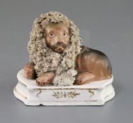 A Lloyd Shelton porcelain group of a lion and a lamb, c.1840, both recumbent on a shaped plinth with