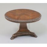 A George IV rosewood banded mahogany miniature breakfast table, with tilt top, triangular base and