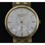 A gentleman's early 1960's 9ct gold Longines manual wind wrist watch, on a 9ct gold Longines