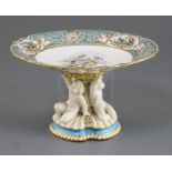 A Minton porcelain tazza, c.1860, with Sevres style flower and bird painted dish top above a gilt