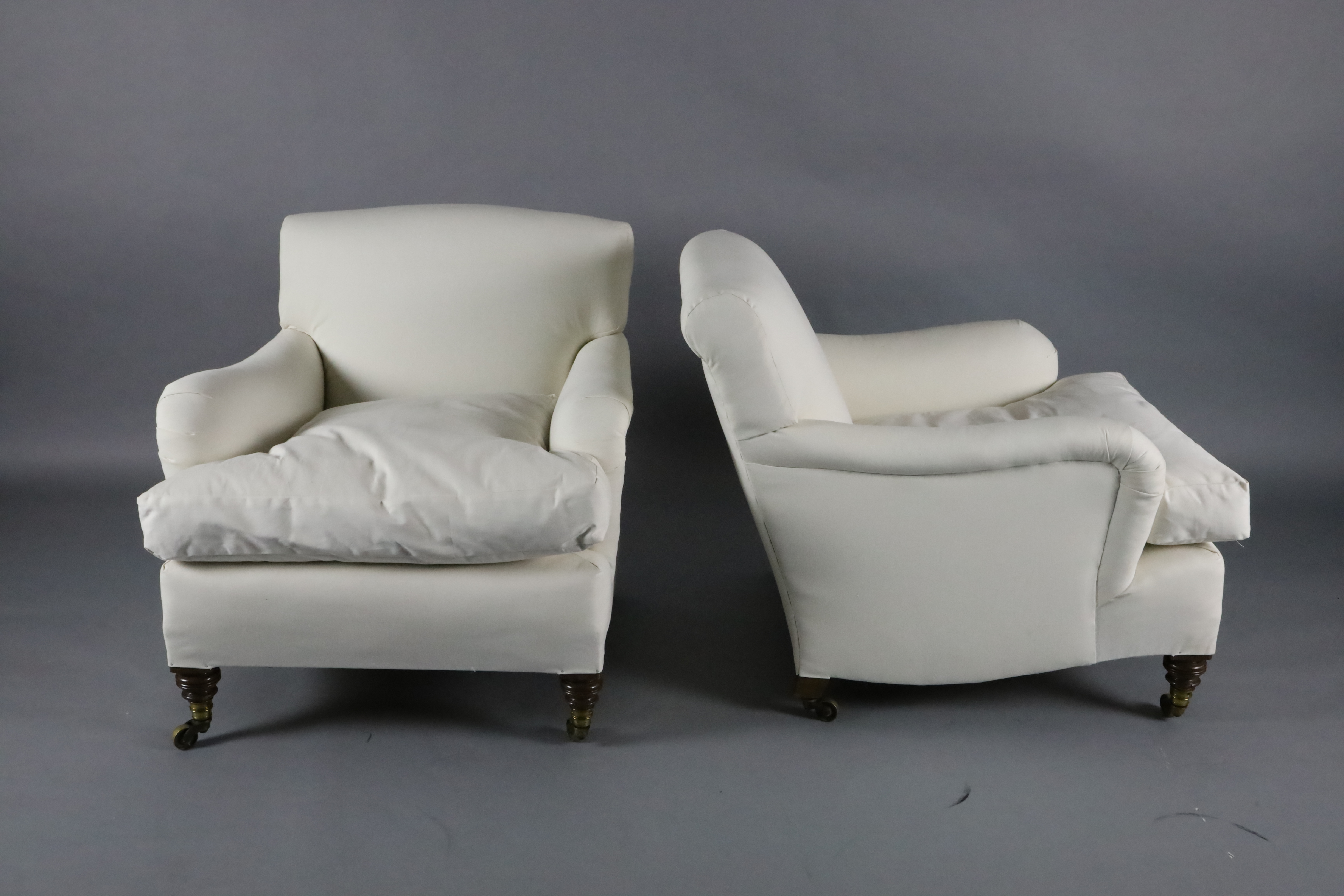 A pair of Victorian Howard & Sons club armchairs