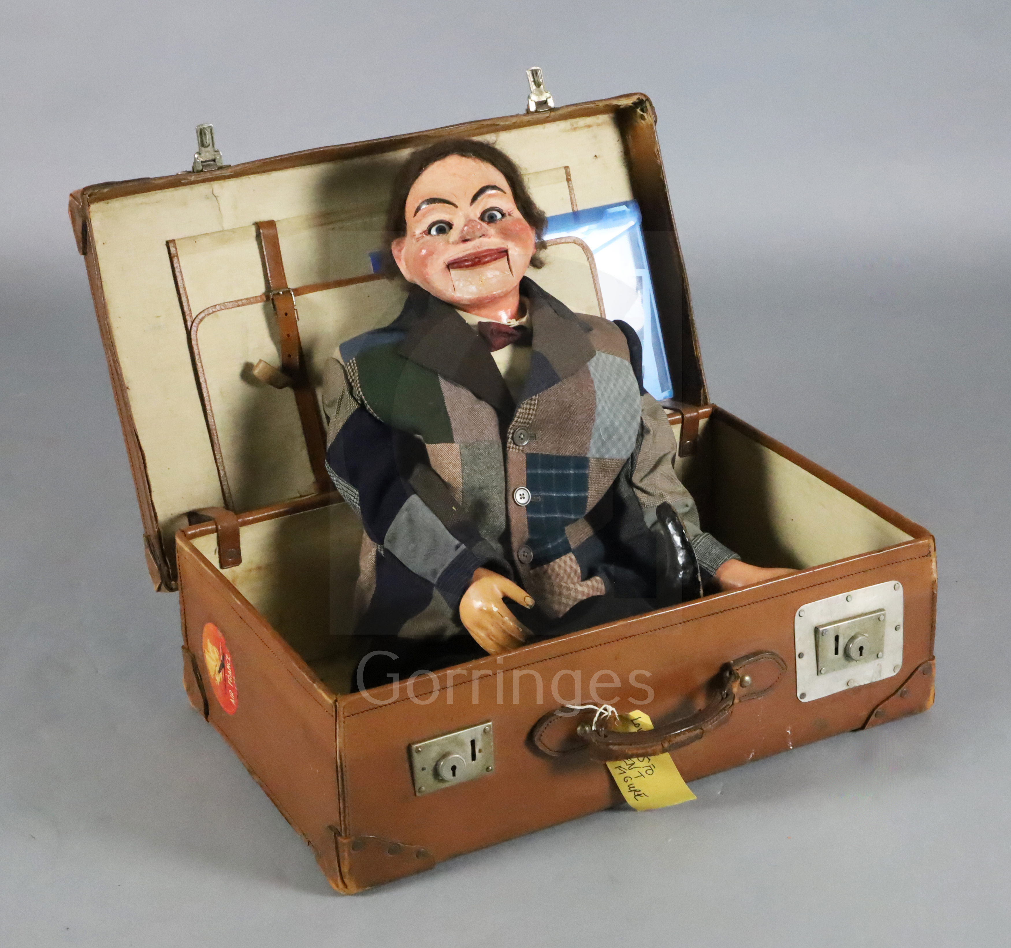 An Edwardian ventriloquist's dummy, 'Jimmy Green', painted papier mache and wood with moving glass
