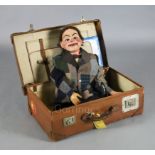 An Edwardian ventriloquist's dummy, 'Jimmy Green', painted papier mache and wood with moving glass