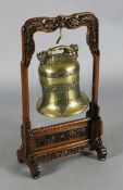 A Chinese Ming bronze bell, 16th/17th century, cast in relief with bands of chilong, taotie mask