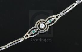 A 1940's 14ct gold and platinum, emerald and diamond set openwork bracelet, 21.5cm.