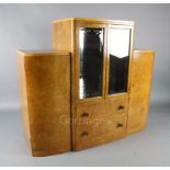 An Art Deco birds eye maple display cabinet and similar dining table, the table with rectangular top