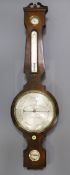 C.Heseltine, Bedford Row. A Regency mahogany wheel barometer with silvered dials 44in.