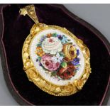 A Victorian yellow metal mounted micro-mosaic oval pendant depicting roses and mixed flowers, with