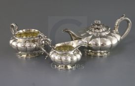 A George IV silver three-piece melon-shaped tea service, London 1827, Rebecca Eames & Edward Barnard