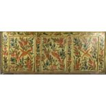 A 19th century Sicilian cream painted section of panelling with three divisions, decorated with