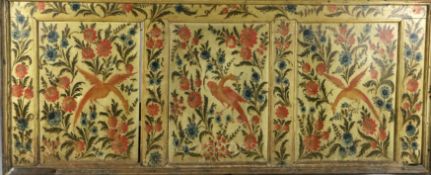 A 19th century Sicilian cream painted section of panelling with three divisions, decorated with