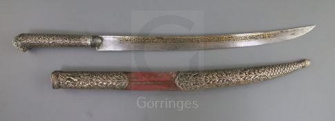 A 19th century Indian silver mounted dagger, with inscribed damascened steel blade, the hilt and