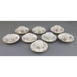 A set of eight Meissen small tea bowls and covers, 19th century, each moulded and painted with