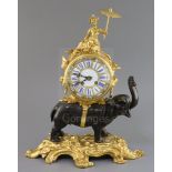 A late 19th century French bronze and ormolu mantel clock, surmounted with a figure of a Chinaman