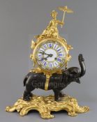 A late 19th century French bronze and ormolu mantel clock, surmounted with a figure of a Chinaman