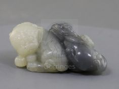 A Chinese grey and white jade lion-dog group, the carver skilfully using the grey inclusion in the