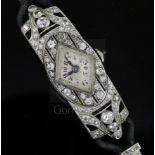 A lady's 1930's/1940's platinum? and diamond set cocktail watch, with diamond shaped Arabic dial, on