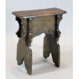 An early 17th century boarded oak stool, 1ft 7.5in. x 8.5in. H.1ft 10.5in.